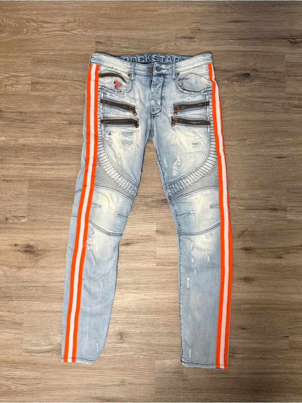 Rockstar Light Wash Skinny Jeans with Orange Stripe Detail